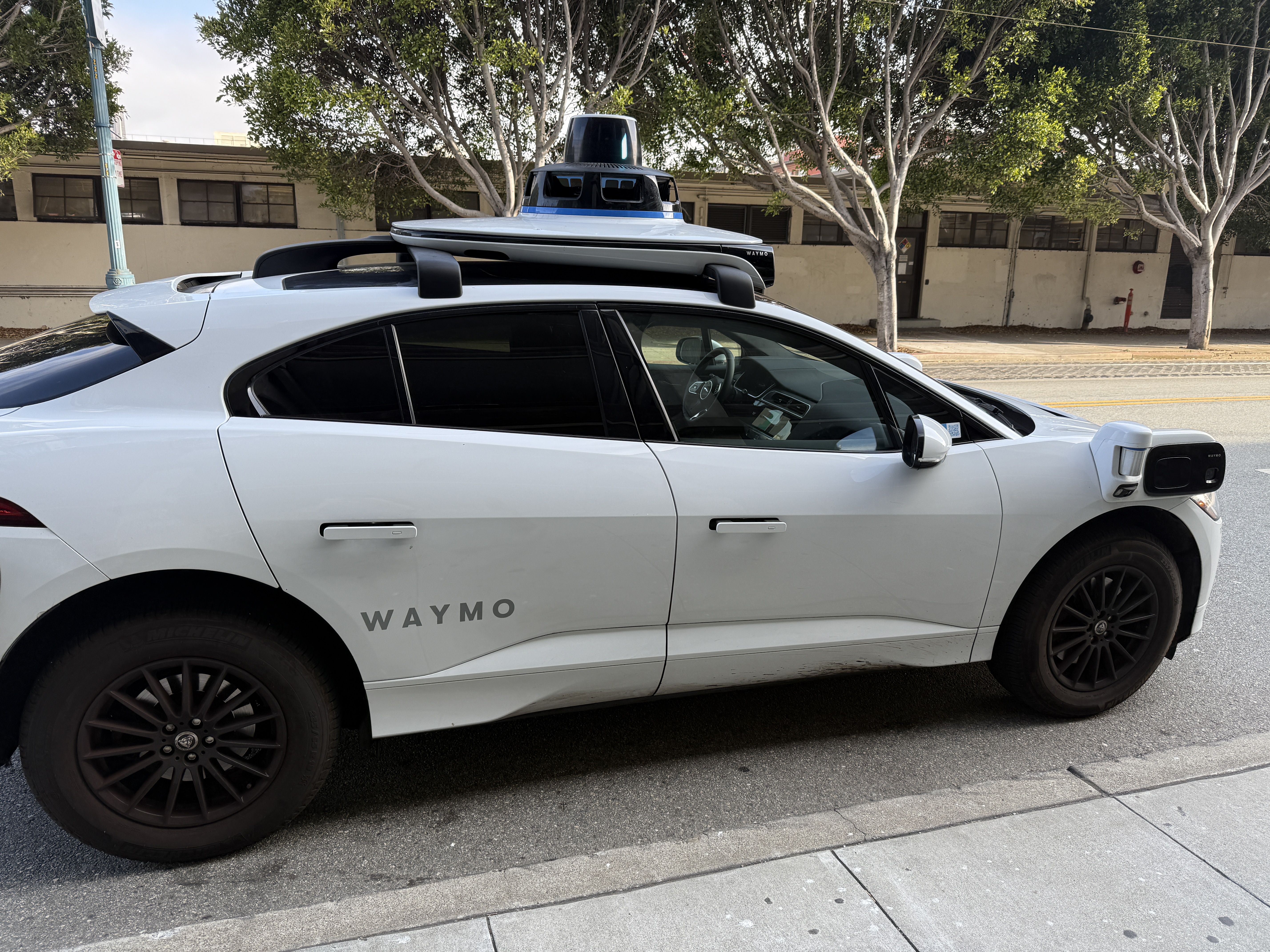 Waymo autonomous vehicle parked on a San Francisco street